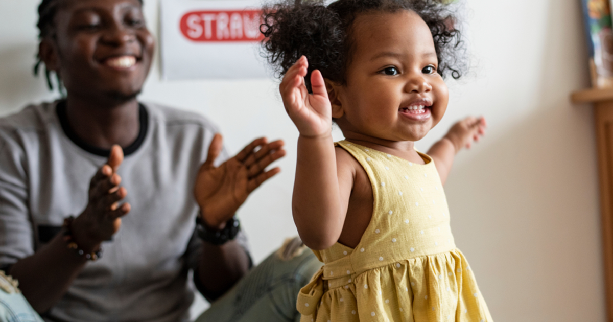 Baby walking along furniture shop