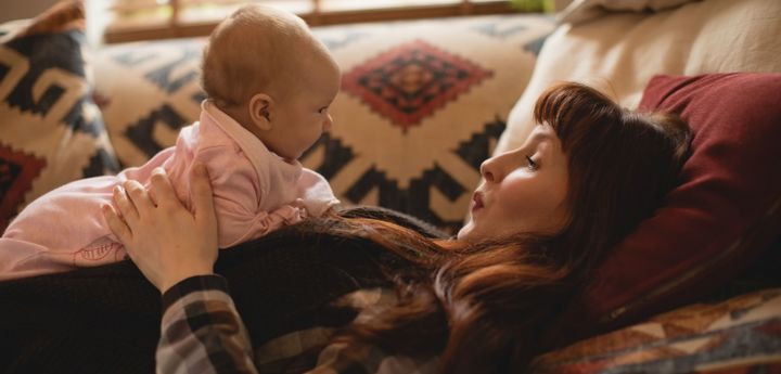 Mother Playing With Her Baby Sofa