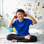 Asian boy using headphones and smiling happy while listening music